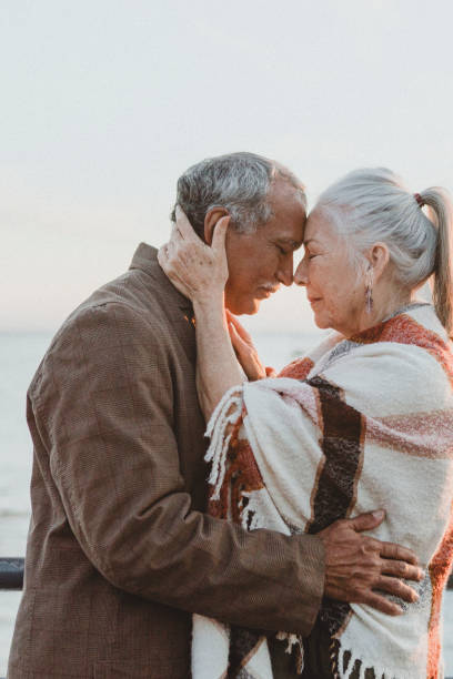 istock Romantic senior couple by the pier 2158066365