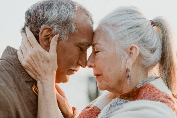 istock Romantic senior couple by the pier 2158066418