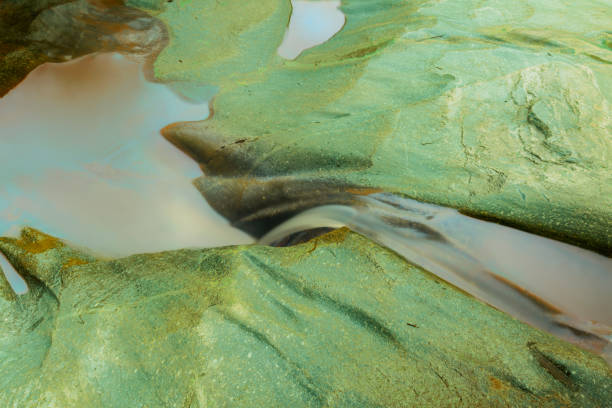 Water flowing through natural rocks in Chiang Mai, Thailand.