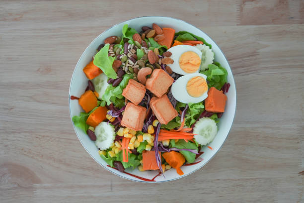 Fish tofu salad on wooden background.