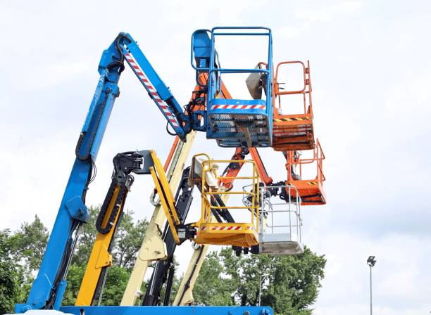 istock Multicolored work platforms of cherry pickers in a row. 2158066993