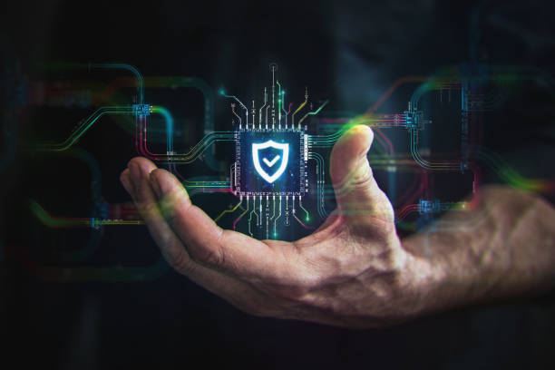 Security in your hand. A hand holds digital shield icon in the center and circuit board with vibrant data transfers, representing evolving security technology of the future.