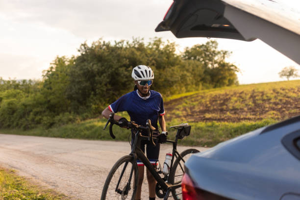 istock Woman preparing for bicycle ride in nature at sunset 2158068760