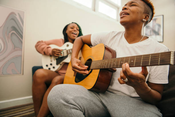 istock Happy lesbian couple singing together 2158069444