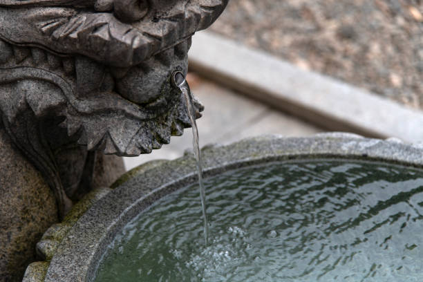 istock flowing water in the stone fountain 2158072056