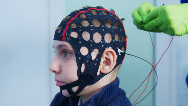 istock Doctor weares  Electrode Cap on Child for EEG Test 2158072162