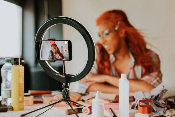 istock Drag queen beauty blogger recording a makeup tutorial video 2158072202