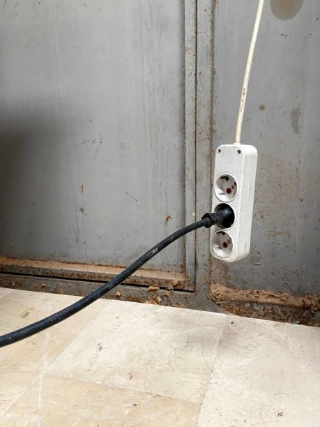 istock Electrical outlet with electric plug connected with extension cord 2158073212