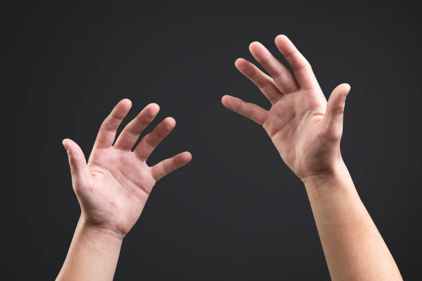Man reaching for helping hand on light grey background, closeup