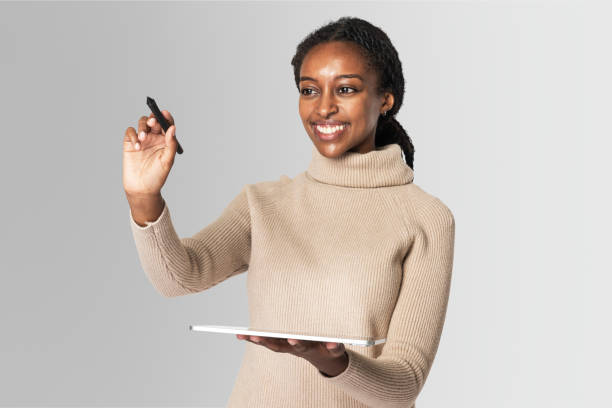 istock Woman holding a tablet and digital pen 2158074597