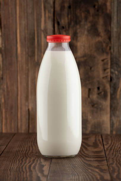 istock Daily fresh cow's milk on wooden background 2158074820