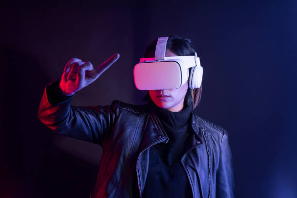 istock Woman playing a virtual video game on virtual screen 2158075021