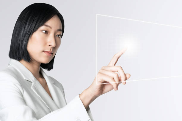 istock Asian businesswoman touching virtual screen 2158075131