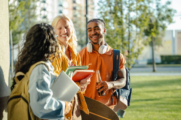 istock Multi-ethnic group of University students hanging out 2158076170