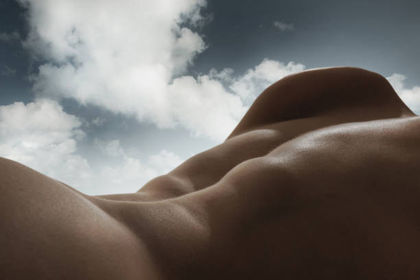 istock Human form and the sky blend into one continuous landscape. Male relief body, back blending with natural sky background. Sense of peace and harmony 2158076436