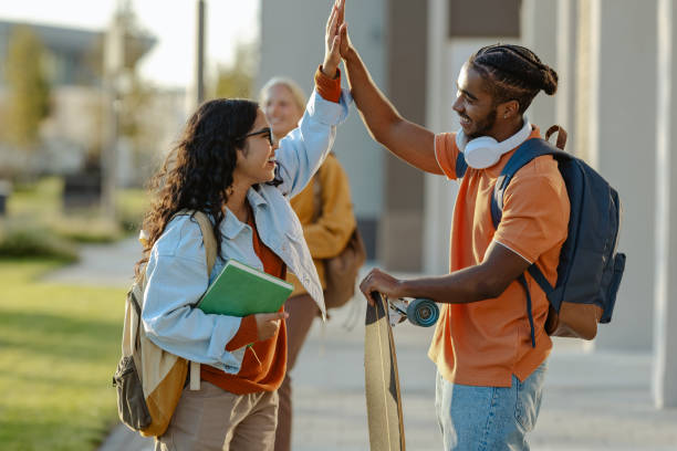 istock Successful diverse students on the street 2158076489