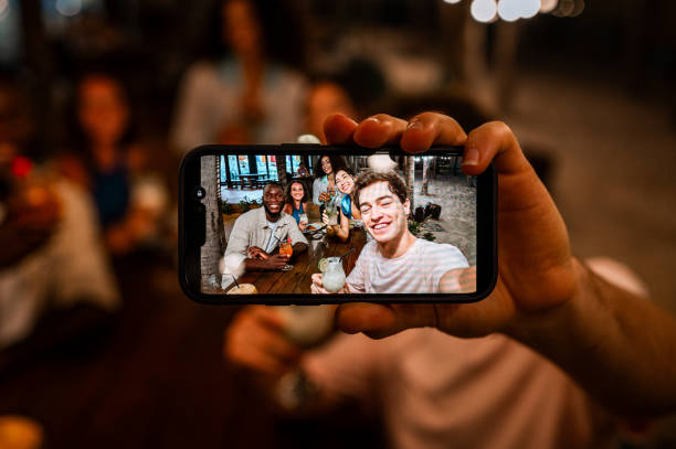 istock Diverse Friends Enjoying Outdoor Dinner Party Selfie 2158079106