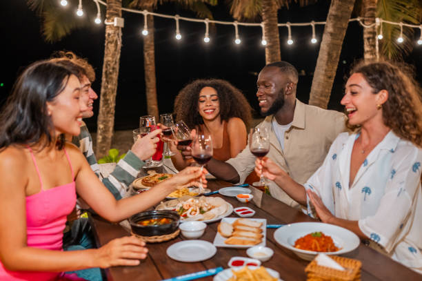 istock Diverse Group Toasting with Red Wine at Outdoor Dinner 2158080014