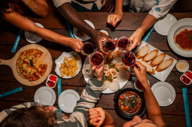 istock Diverse Friends Toasting at a Dinner Party 2158080035