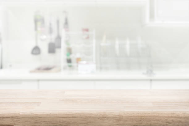 istock Selective focus.wood  top  kitchen island on blur kitchenware on white  wall  interior 2158080195