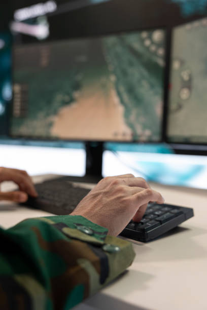 istock Combat IT engineer supervising and assisting team members in the field 2158081095