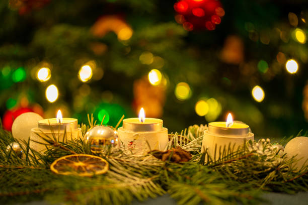 istock Candles in front of the Christmas tree. 2158081163