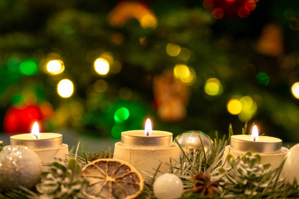 istock Candles in front of the Christmas tree. 2158081170