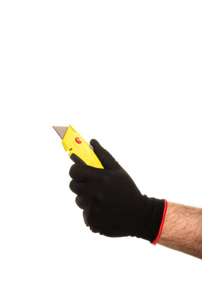 istock Segmented blade or snap-off blade utility knife in male hand isolated on white background. 2158082723