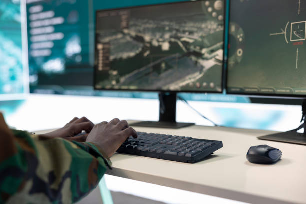 istock Army IT professional targeting enemy vessels on gps satellite station world map 2158083145