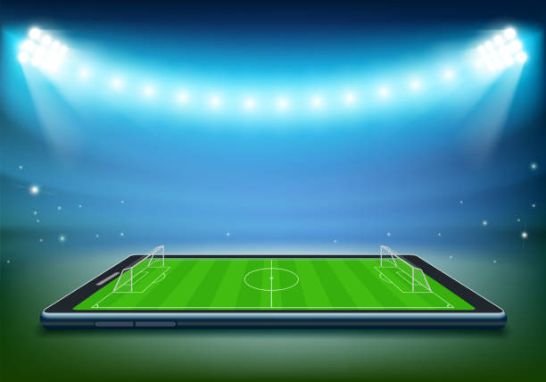 istock Smartphone with a football field on the screen. 2158083257
