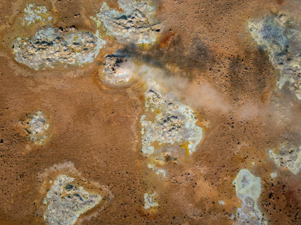 istock Bubbling mud pot in a geothermal area, directly above view 2158083281