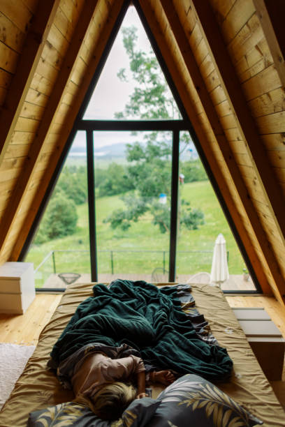 istock Beautiful woman sleeping in a mountain house 2158086735