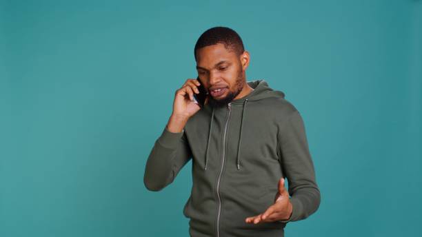 istock Irked man fighting with friends during telephone call 2158086842