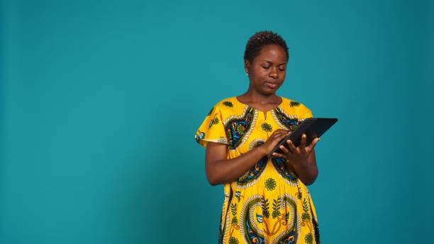 istock Young woman checking her social media platforms in studio 2158087506