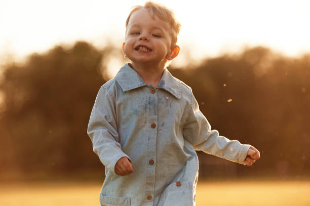 istock Having fun, running. Little boy is on the summer field 2158089487
