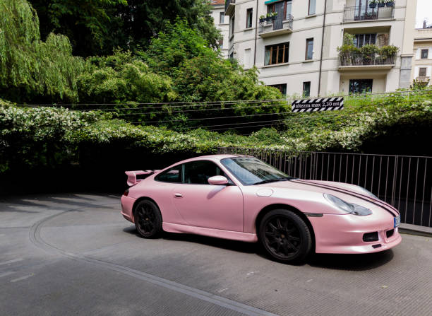 Milan, Italy, June 18, 2024 - modern Porsche parking in street. Sports german car