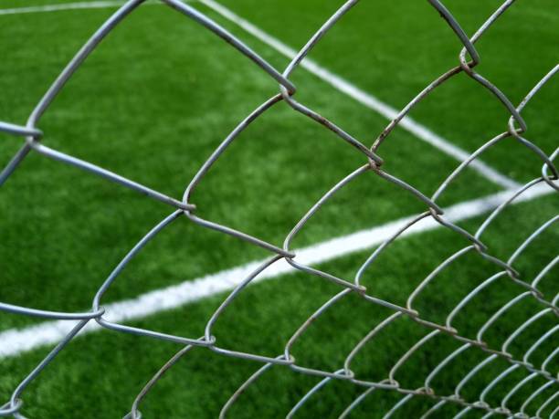 istock Football field fencing 2158089686