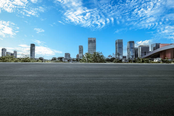 Empty asphalt square road and modern city skyline background