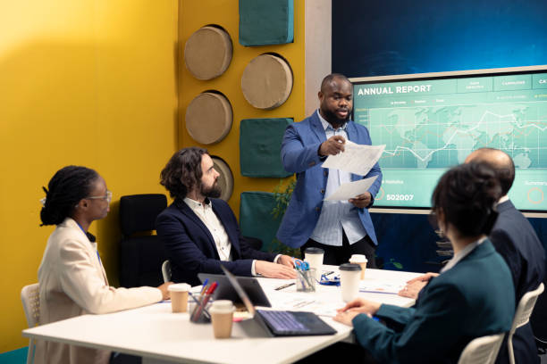 istock Corporate employees review transactional info to improve customer satisfaction 2158090389