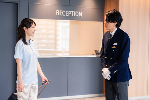 istock Hotel staff showing guests around 2158090534