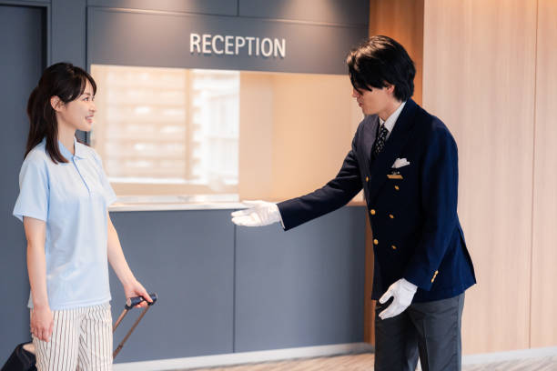 istock Hotel staff showing guests around 2158090538