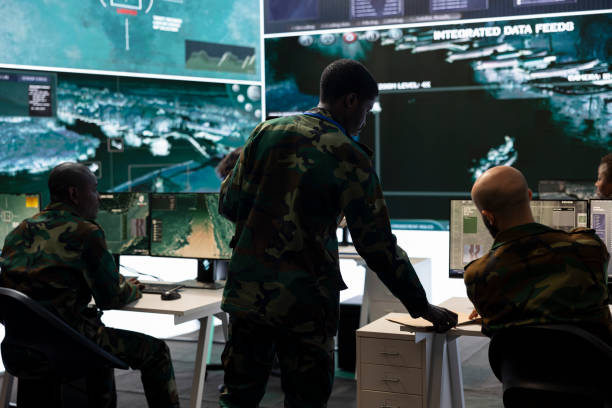 istock Army recruit conducting an intelligence gathering activity in control room 2158090787