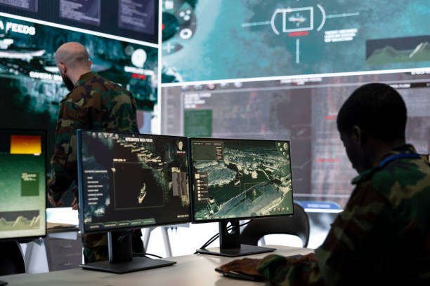 istock Trooper examines surveillance radar CCTV imagery in control center 2158092410