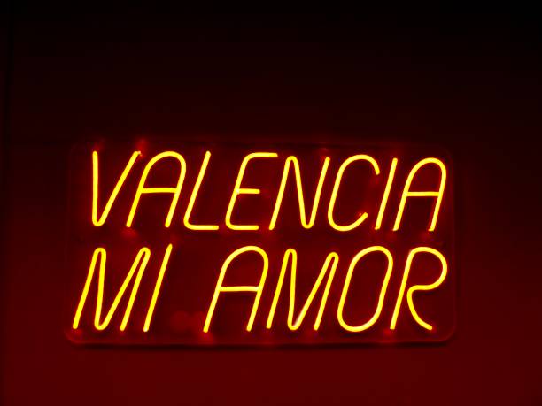 istock valencia mi amor - is a lighted orange neon sign 2158092933