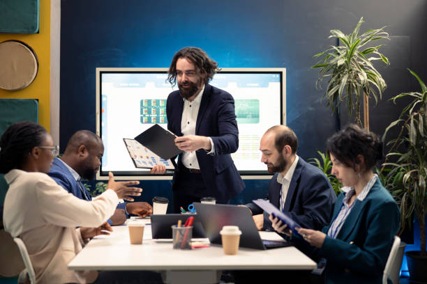istock Executive team develops strategic plans and financial projections during meeting 2158092969