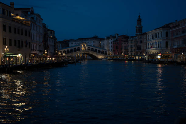 Venice at night Canale Grande Rialoto Bridge\nSee from a boat during the golden hour.\nVenice, Italy, 14th of June 2024