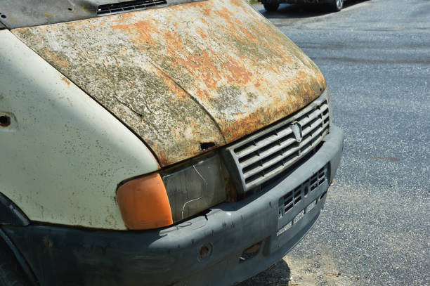 istock a broken-down, old rusty car. an abandoned car. background for the design. 2158097984