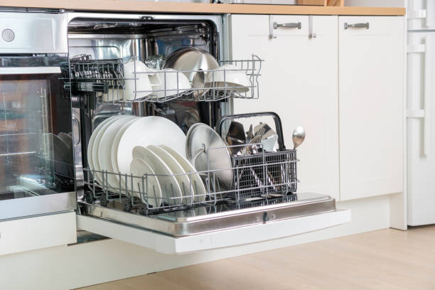istock Full load dishwashing machine. Clean dishes and cutlery. convenience in the modern kitchen 2158099990