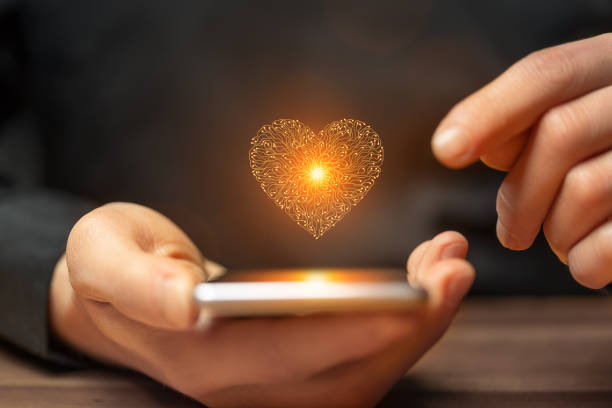 istock Artificial intelligence heart symbol on a smartphone held by a man 2158100260