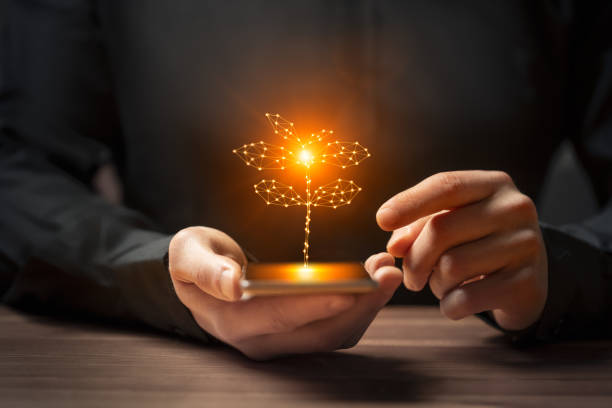 istock Artificial intelligence new life plant symbol on smartphone in hand 2158100275